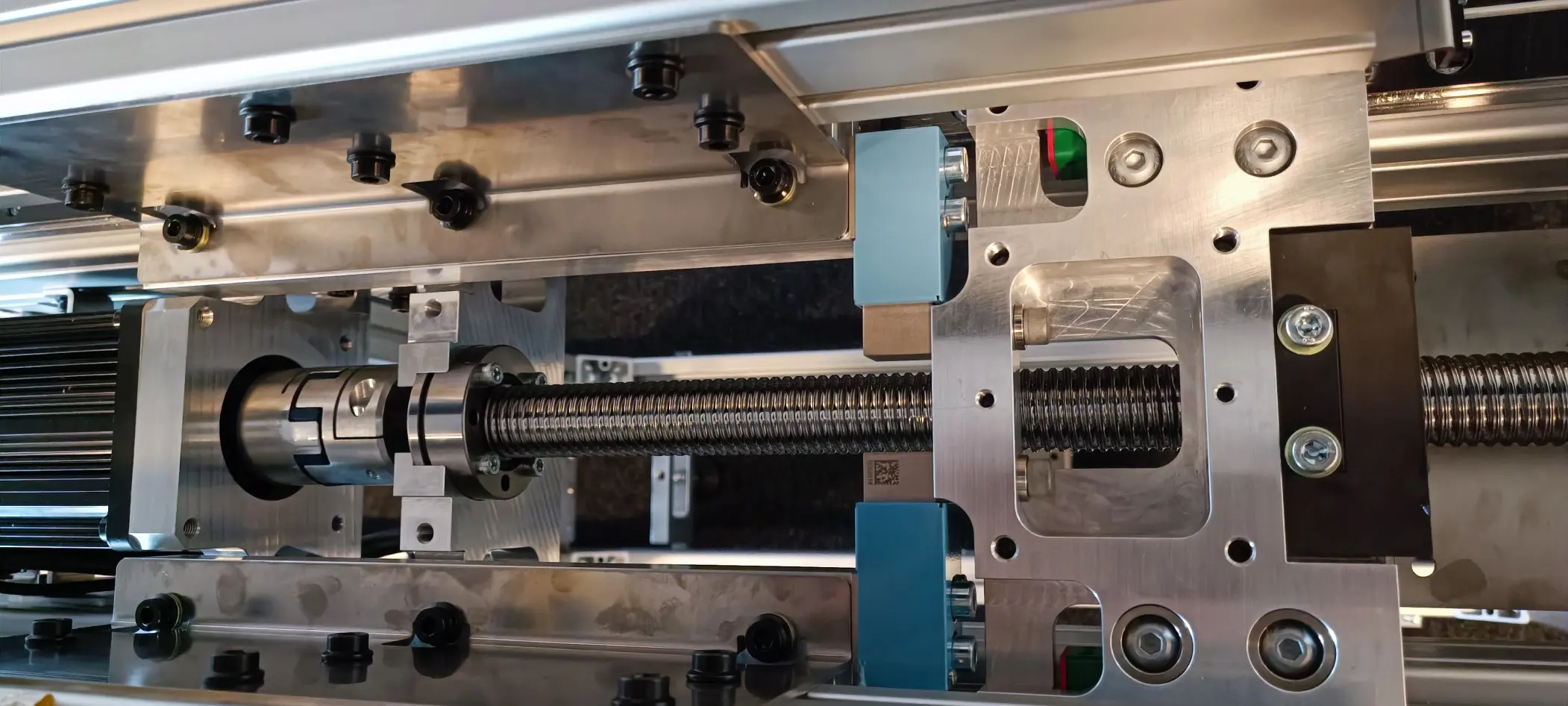 The ball screw drive with motor and coupling, as built