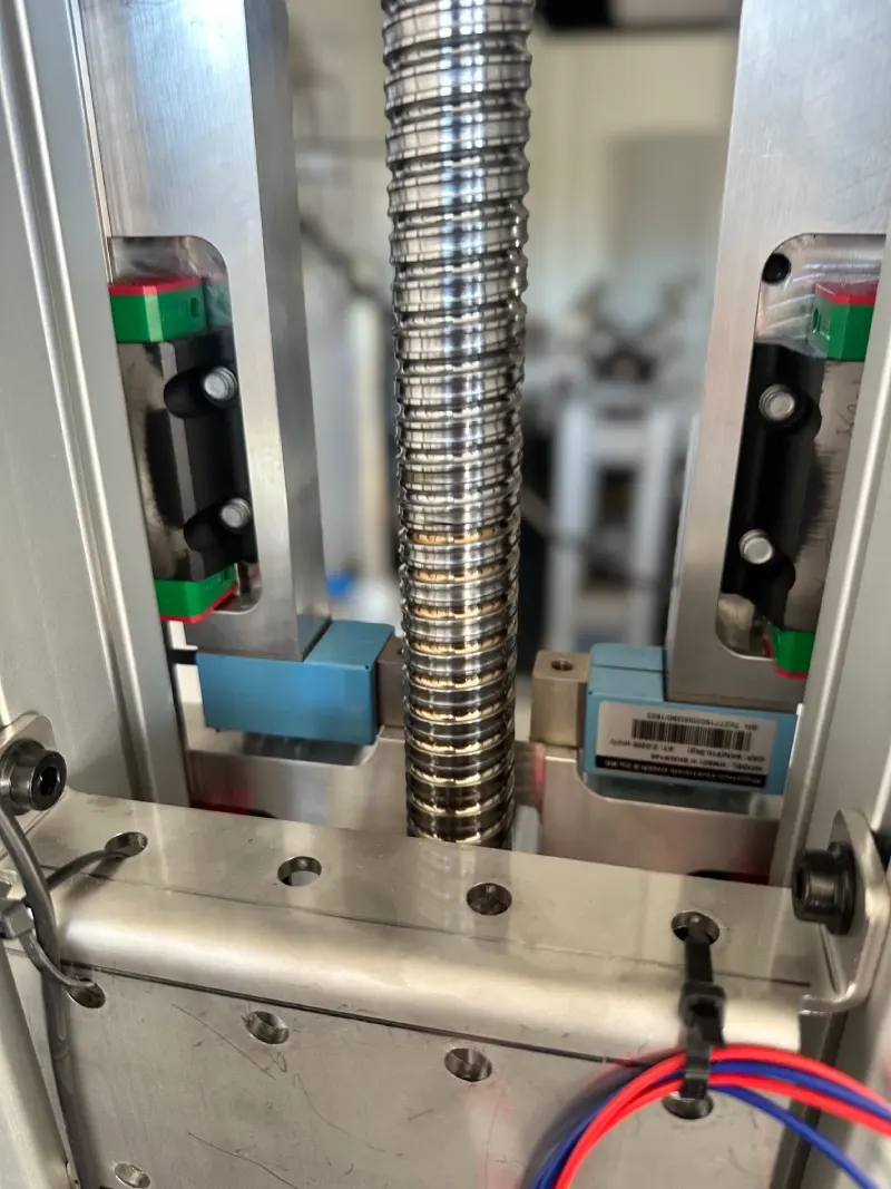 The screw with the two limit switches used for homing