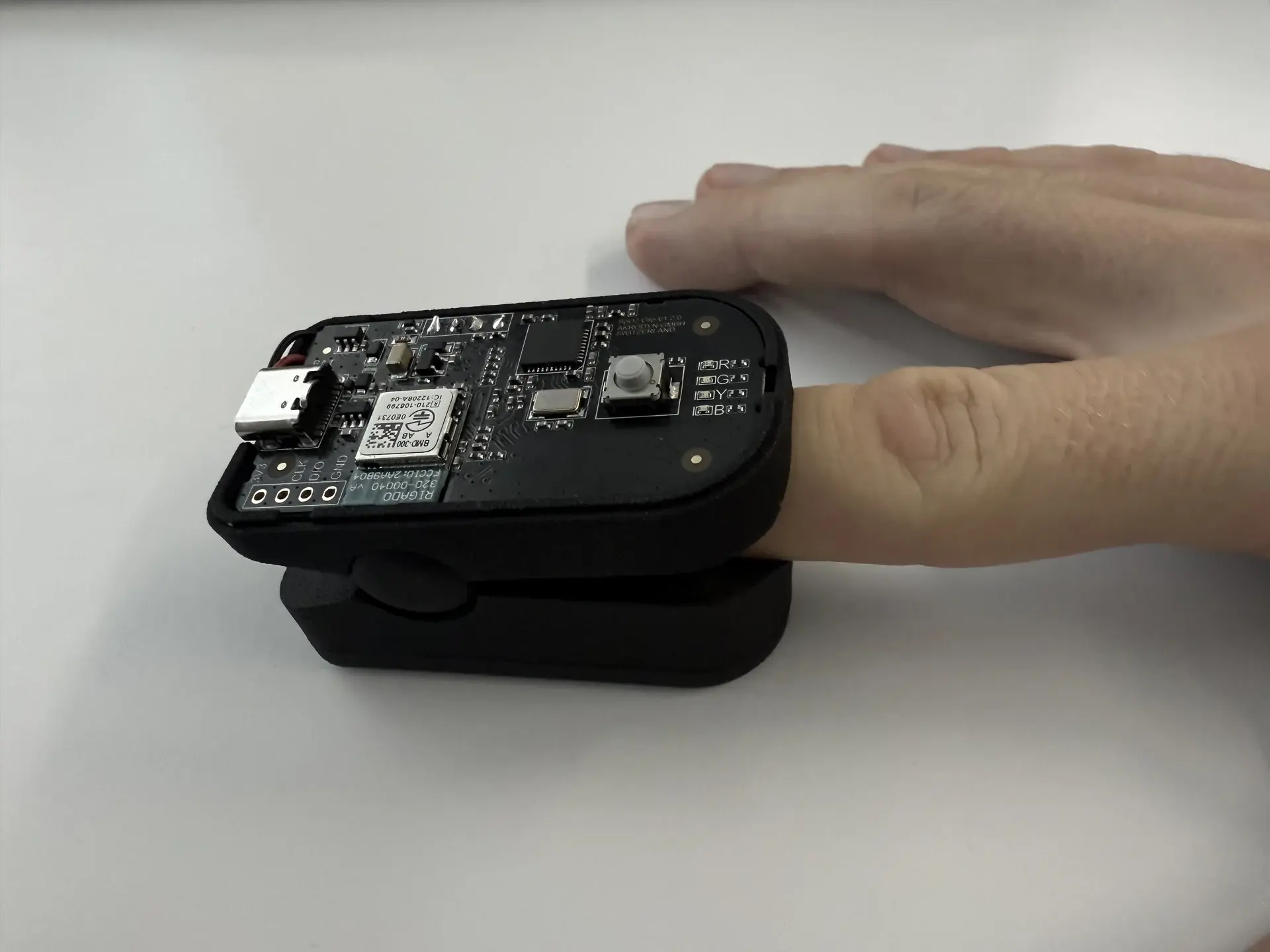 PPG sensor open: view of the PCB with Bluetooth module, microcontroller and multi-colour light sensor