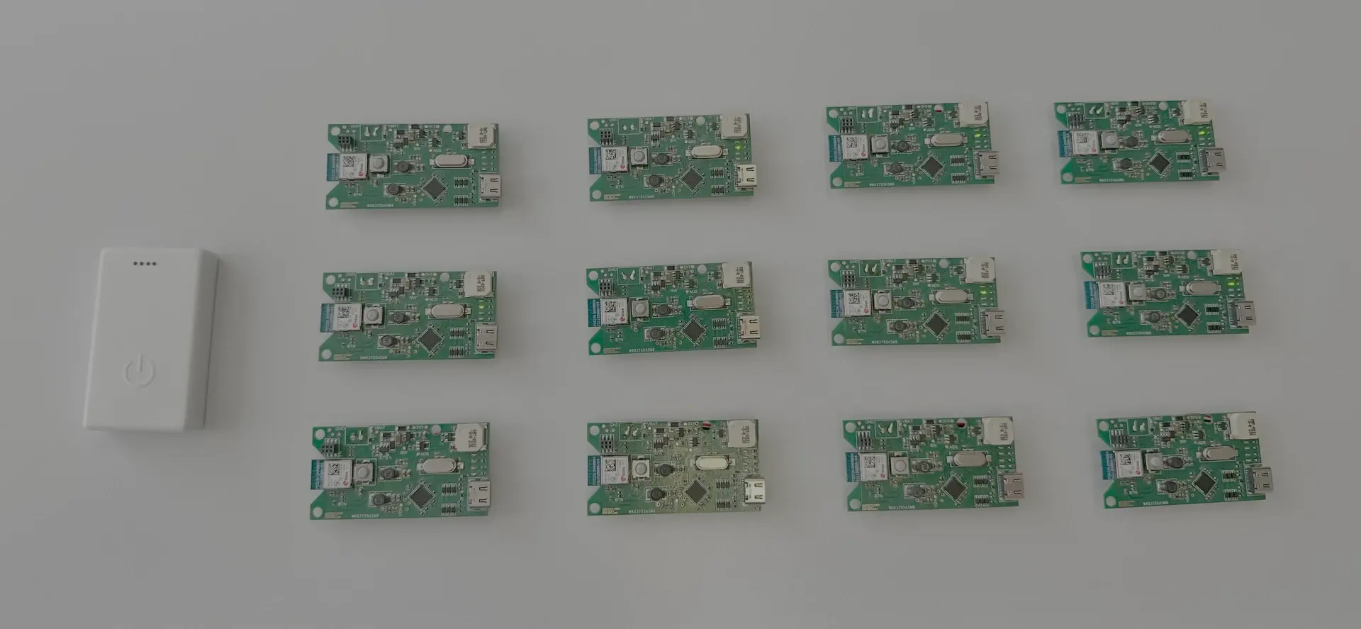 Vitalscanner housing next to six populated PCBs from the first prototype series