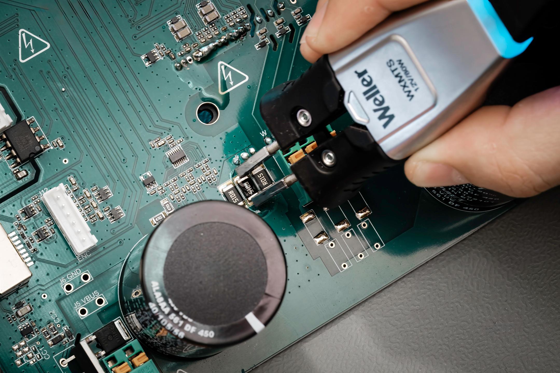 Circuit board with Weller soldering iron
