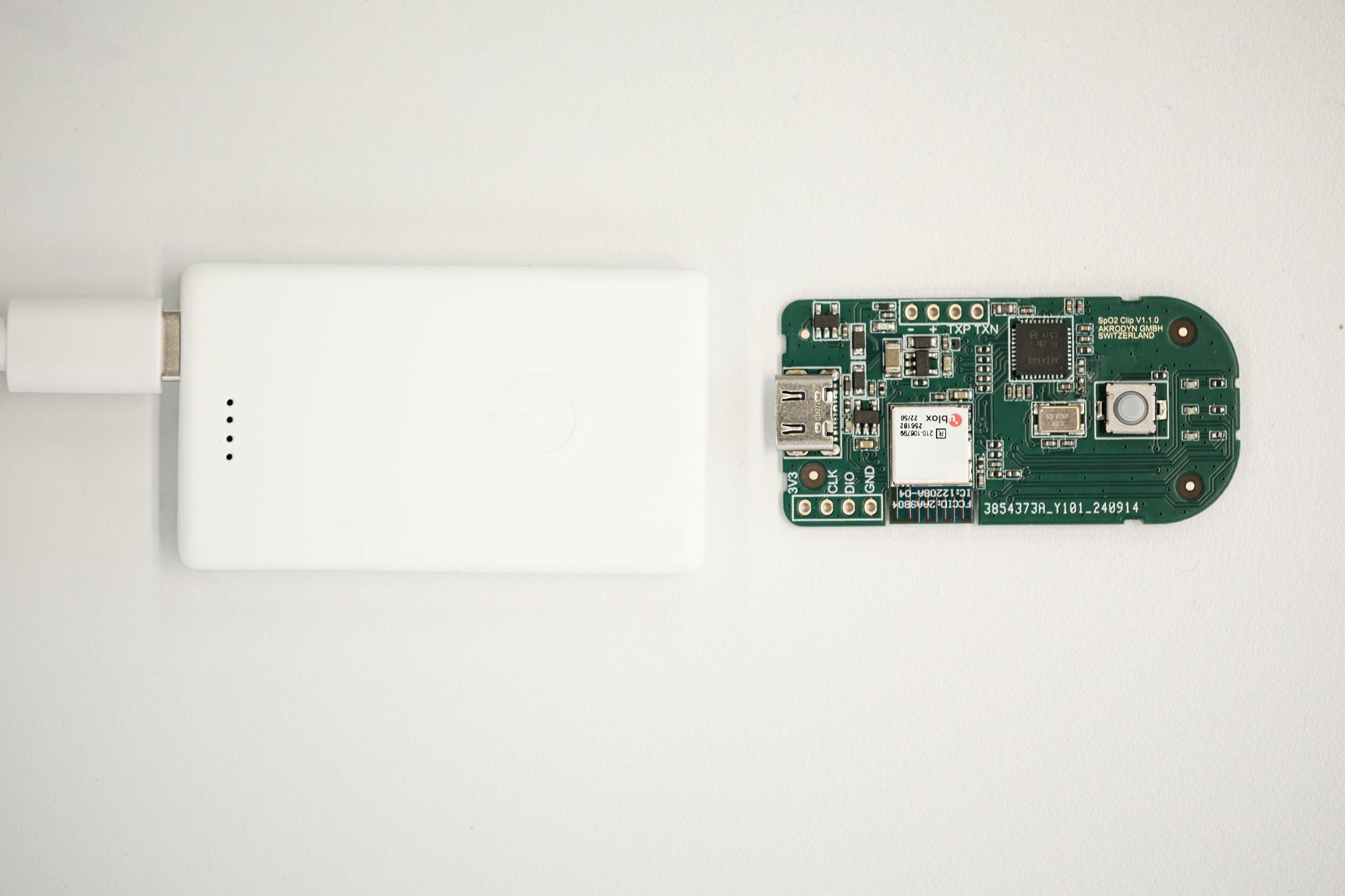 SpO2 sensor PCB next to finished IoT product